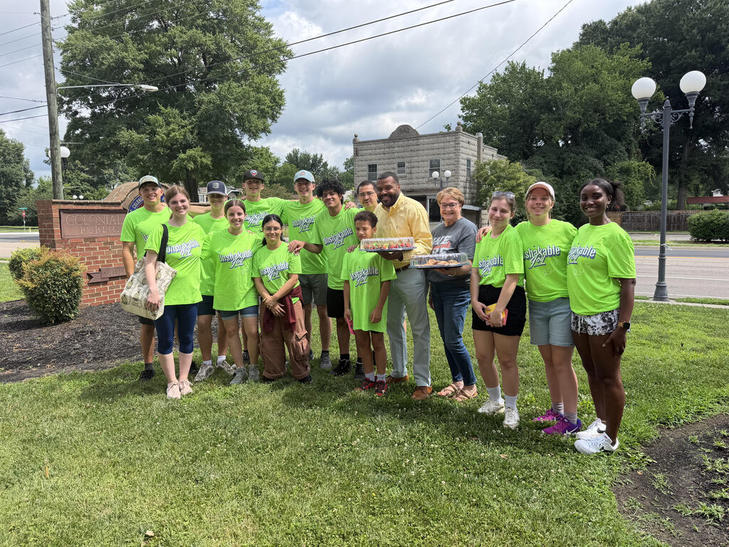 Superintendent with Church Group Accepting Donations