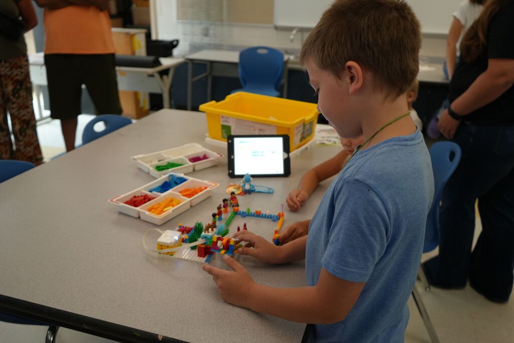 Boy with Lego Creation and iPad