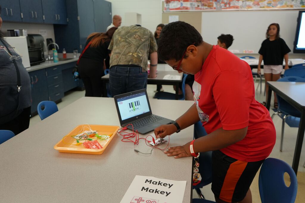 Student Setting up Makey Makey Piano