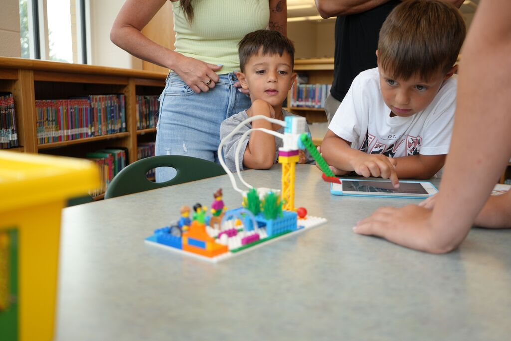 Small Boys Using iPad with Legos