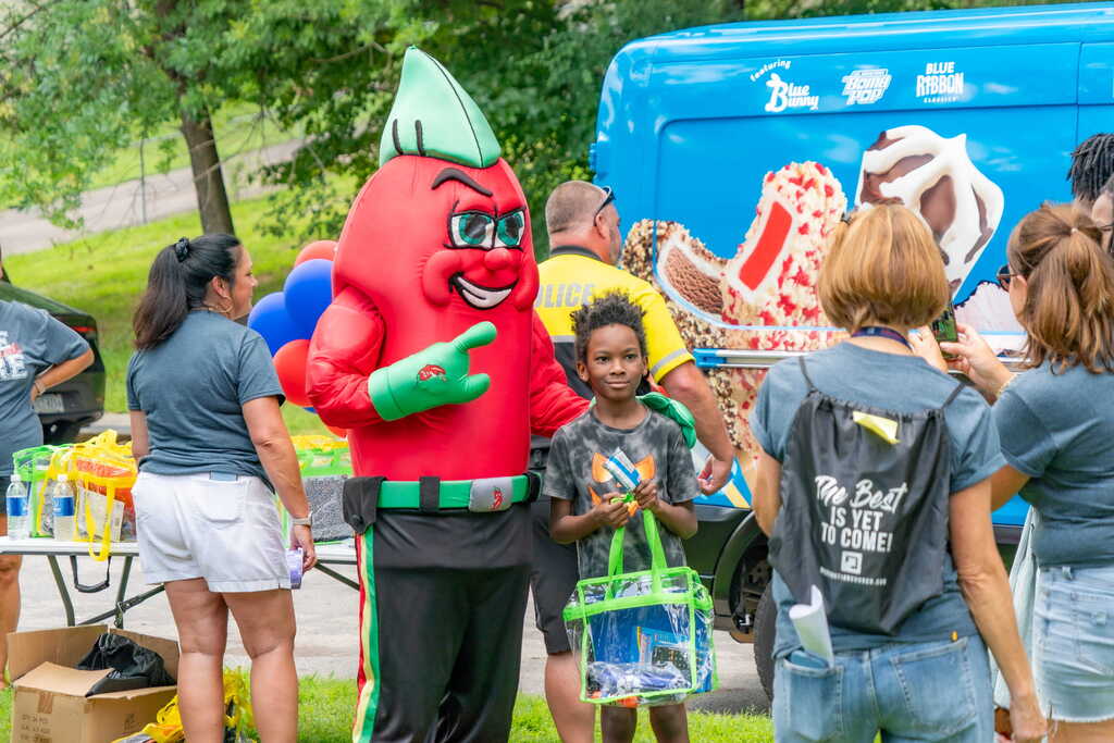 Chili Pepper Mascot with Student