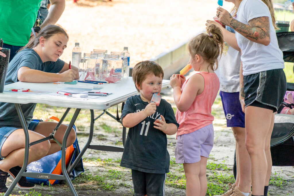 Kids Eating Ice Cream while Teacher fills out paperwork