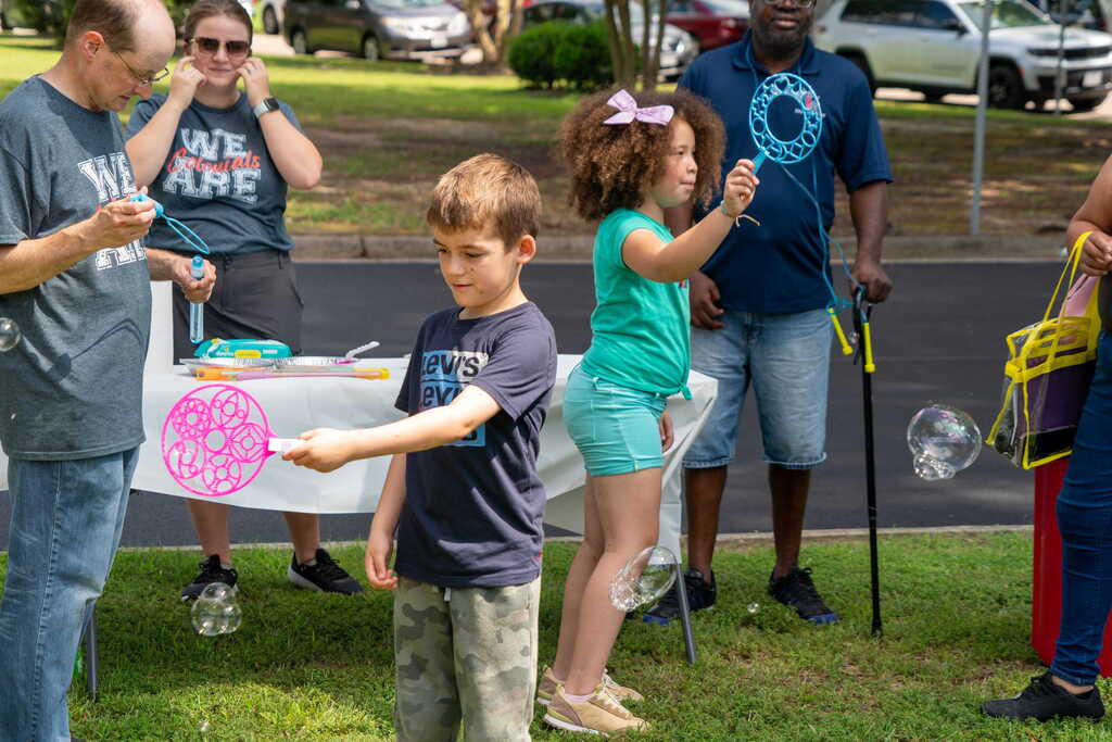 Students playing with bubbles