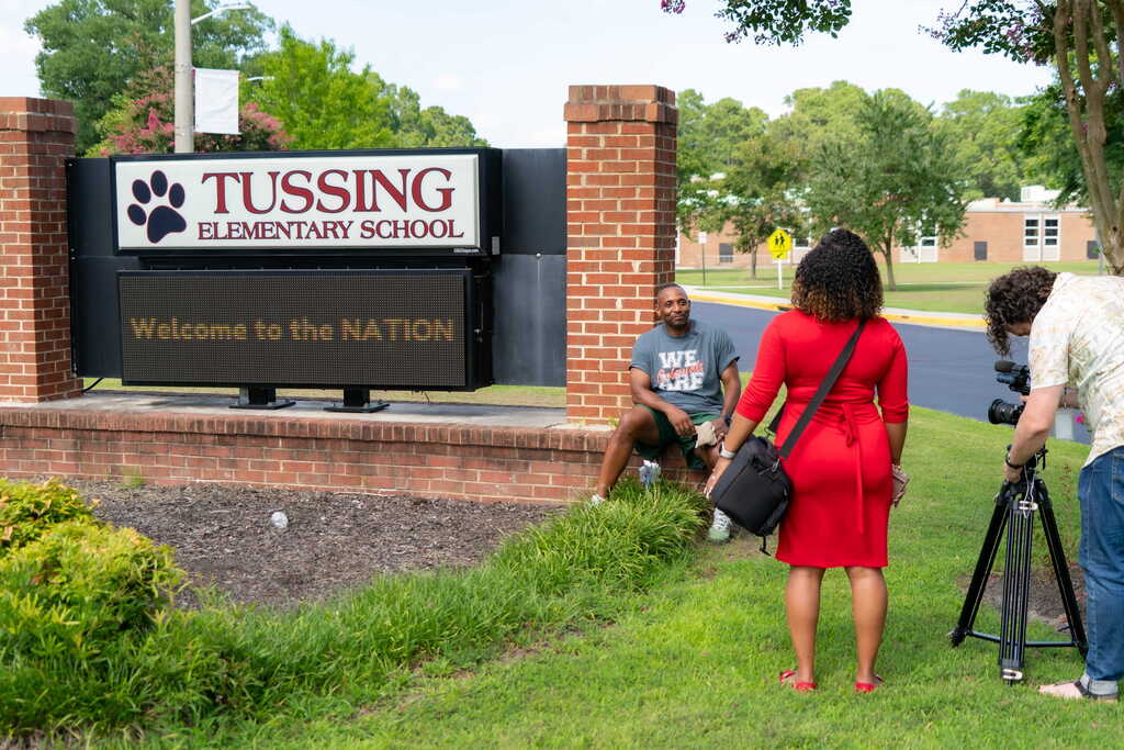 News interviewing principal at tussing elementary