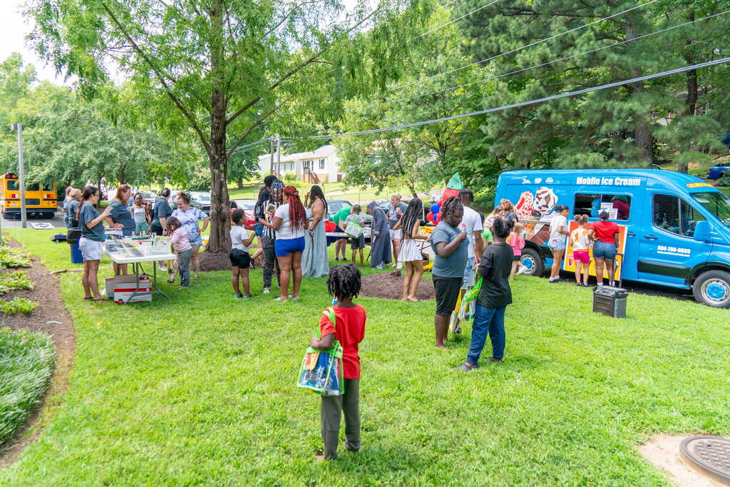 Whole Group engaged in activities, ice cream truck, playing, and free books