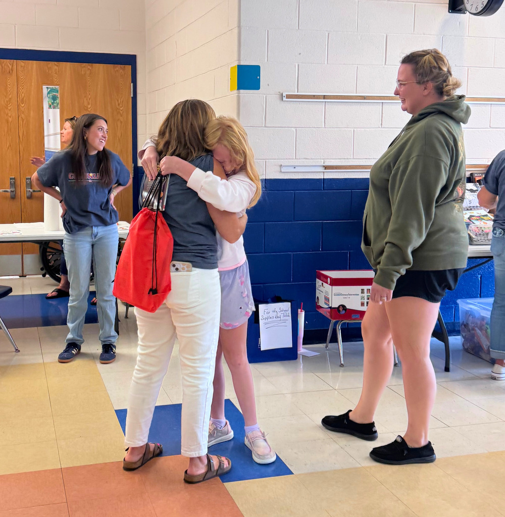 Student Hugging Teacher