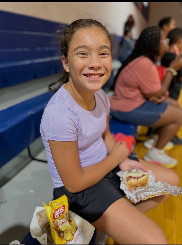 Girl Posing with Dinner and Big Smile
