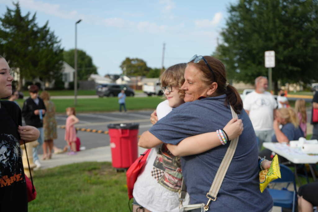 Teacher Hugging Girl
