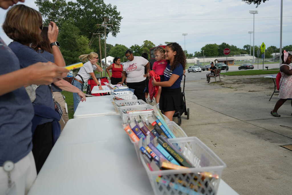 Families Picking Up Books
