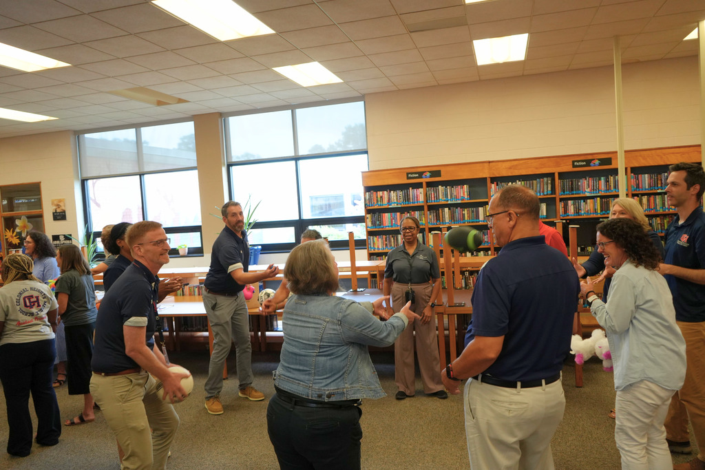 Leaders Playing Game and Tossing Balls