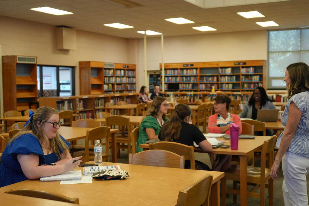 New Teachers Listening to Lesson in Library