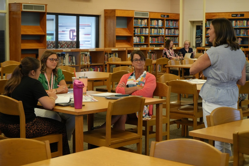 New Teachers Listening to Lesson in Library