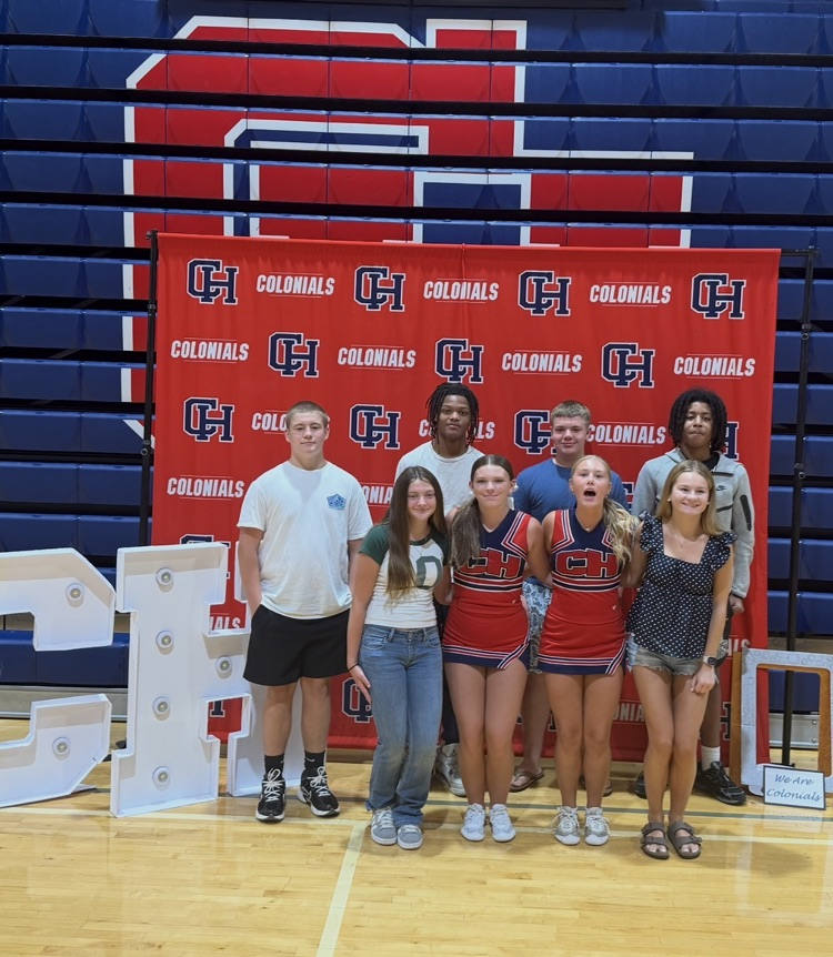picture of 7 students at 9th grade orientation behind the CHHS backdrop
