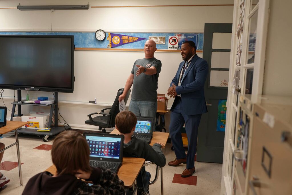 Superintendent and Teacher with Students