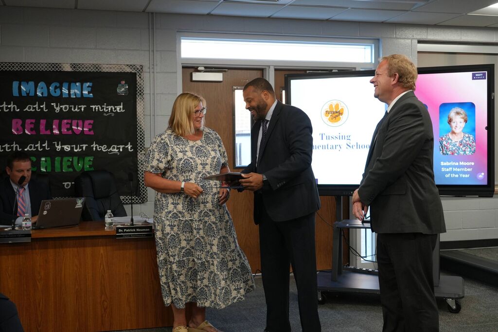 Tussing Teacher of the Year, receiving award from Superintendent