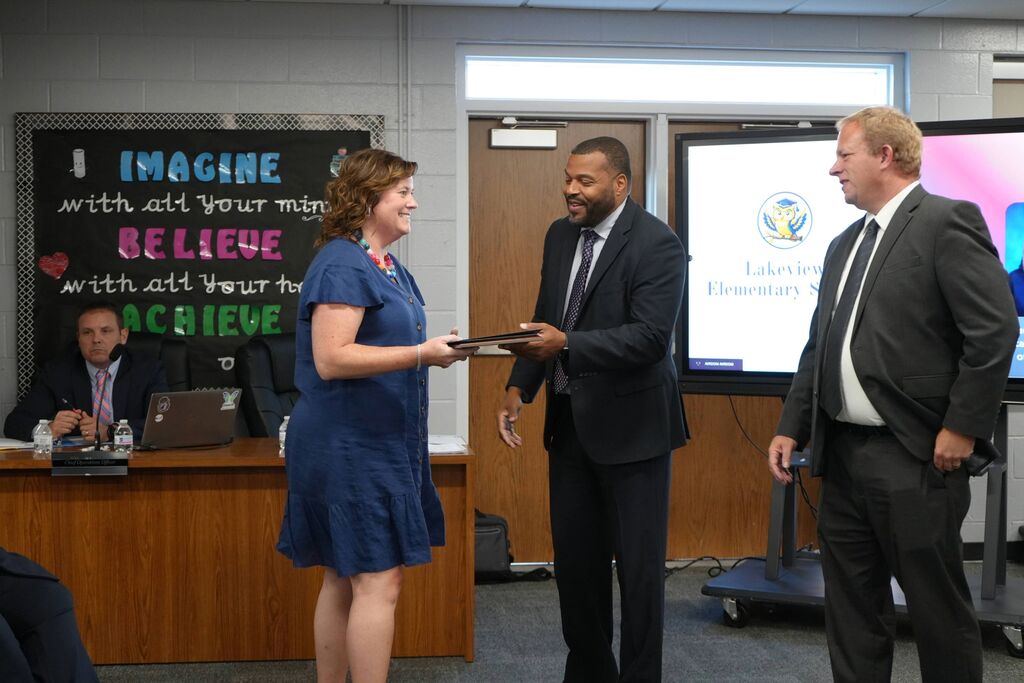 Lakeview Teacher of the Year, receiving award from Superintendent