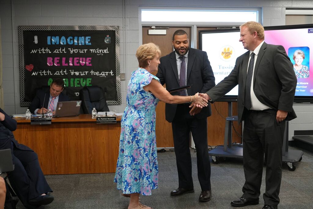 Tussing Support Staff Member of the Year, receiving award from Superintendent