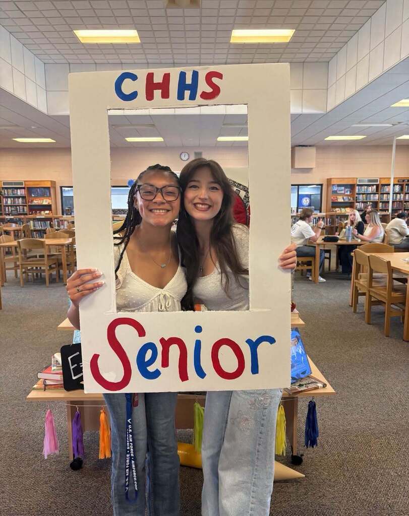High school senior girls posing in Senior photo frame