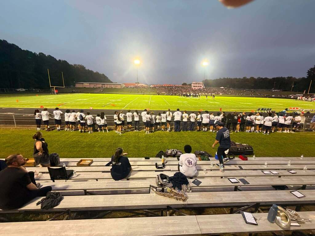 CHPS band at football game along the fence