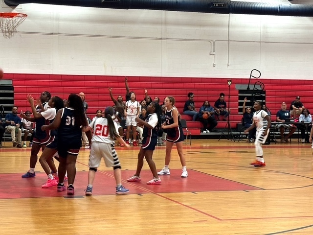CHMS Girls Basketball team rebounding.