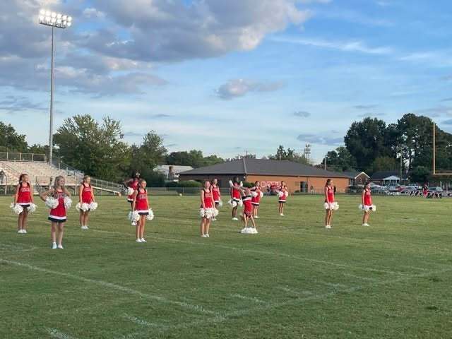 Middle school cheerleaders on field
