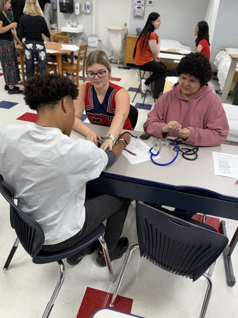 Nursing Students Practicing Taking Blood Pressure