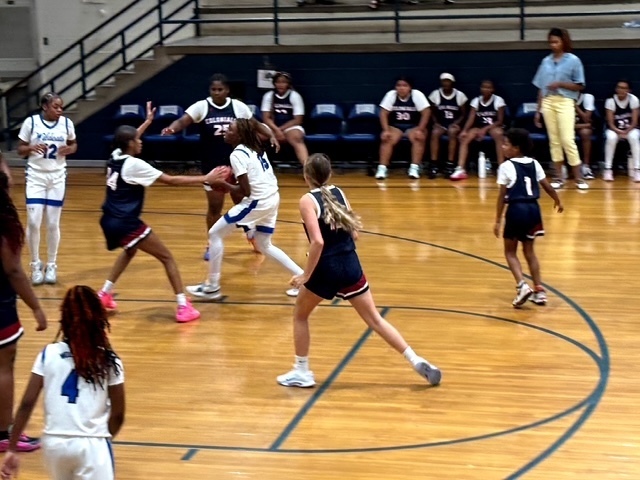 Girls Basketball playing stiff Defense