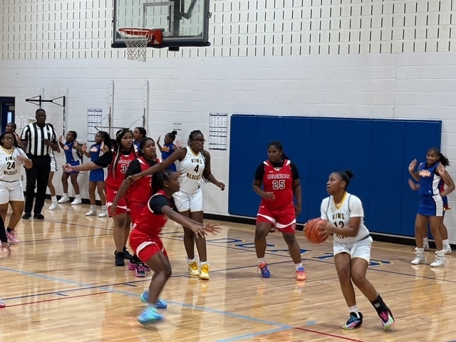 Girls Basketball playing hard defense