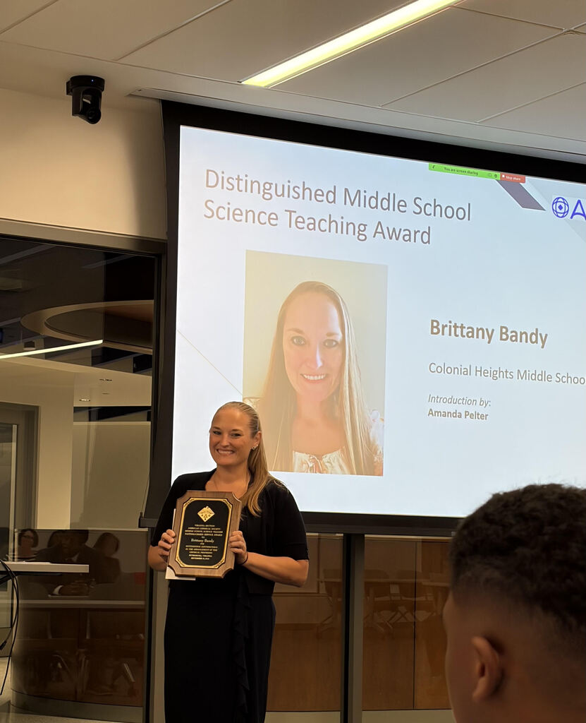 Ms. Bandy with her plaque of regcognition