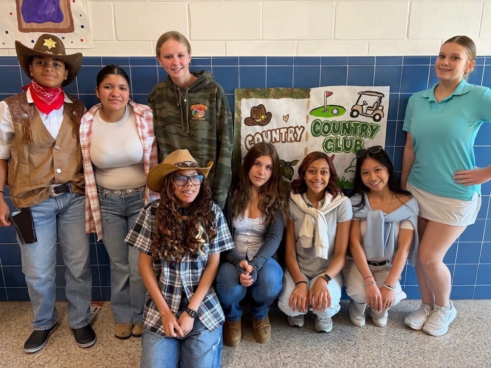 Gourp shot of students dressed for country and country club day