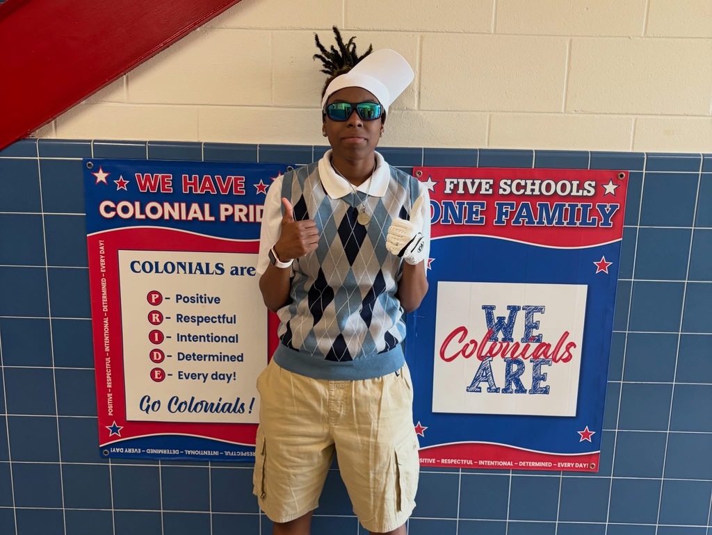 Student standing with thumbs up posing for Country Club day