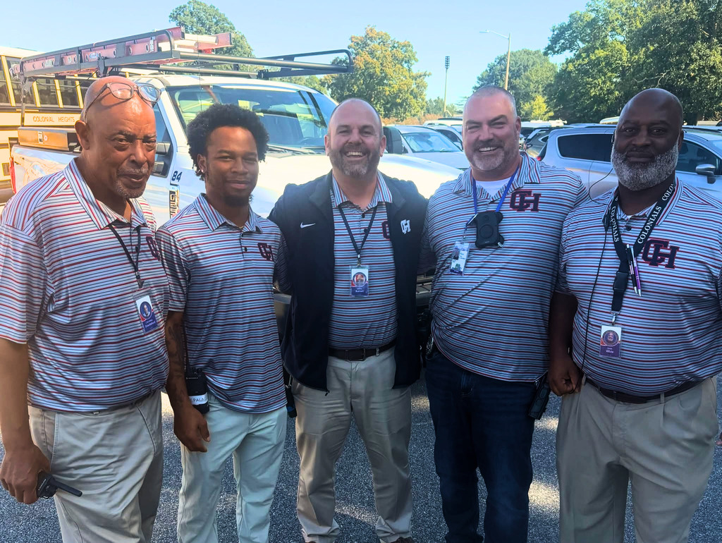 CHHS Admin and Maintenance Team in matching colonial heights polos for twin day