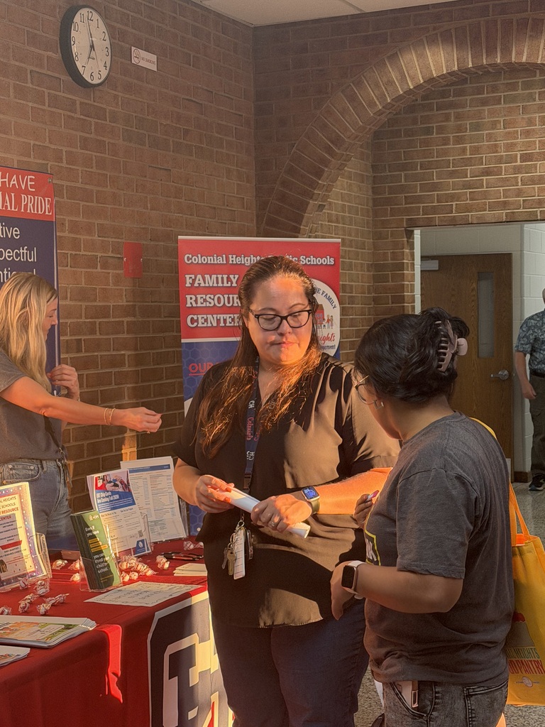 ESL Translator talking with parent about available parent resources