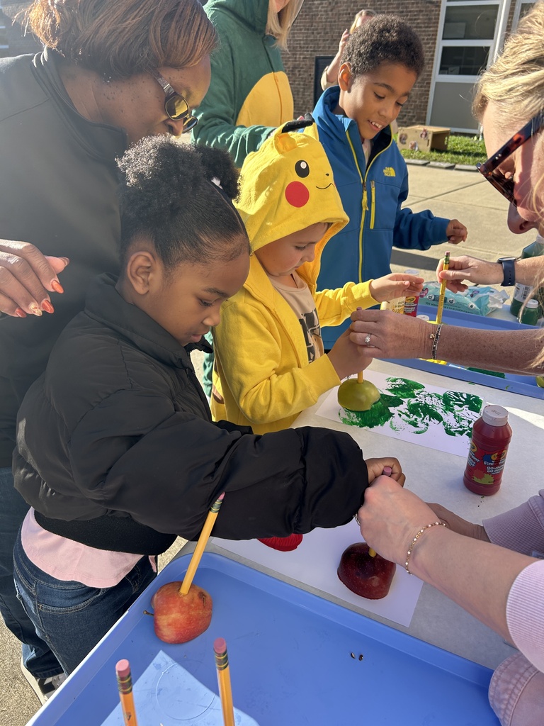 Students painting with Apples