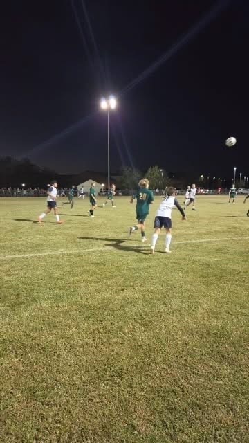 Boy throwing the ball in at the soccer game