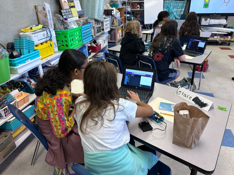 Girls Collaborating on Coding