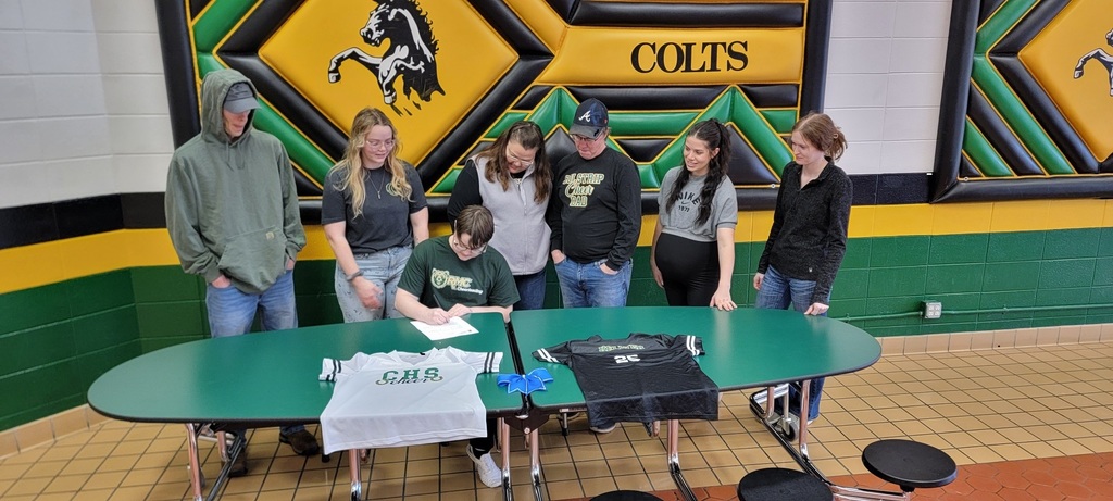 Ollie signs his letter of intent.
