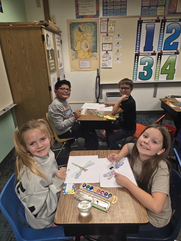 3rd grade collaborating on some mosaic art