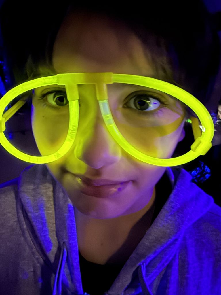 kid with glow glasses