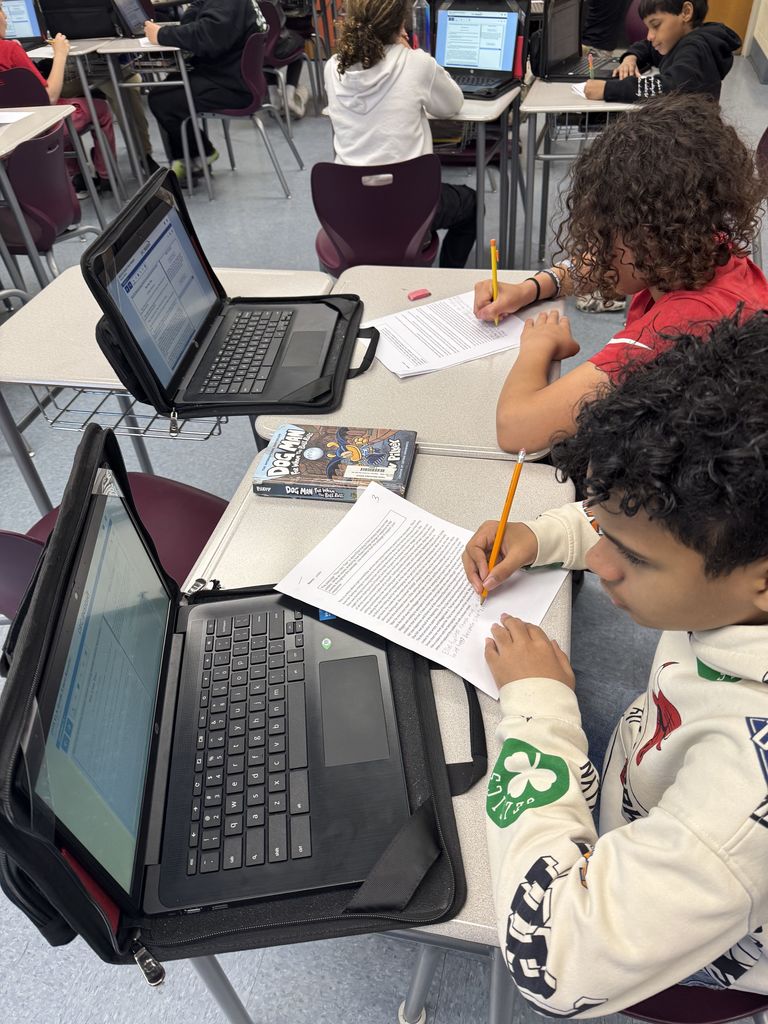 kids sitting at a desk working