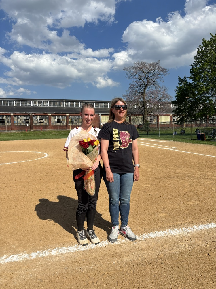 softball player and her parent