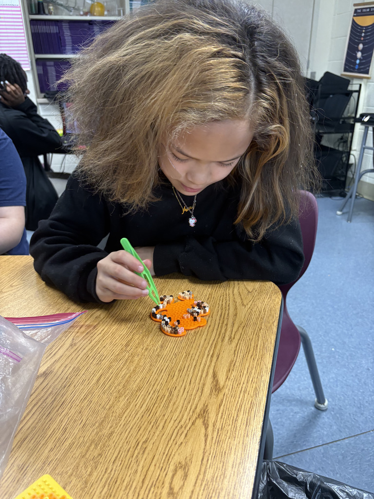 student working on a bead project