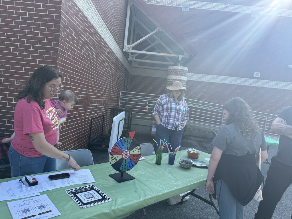 group of people at a table during earth day