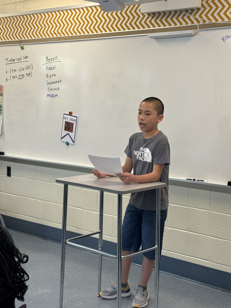 Student giving a speech in front of the class
