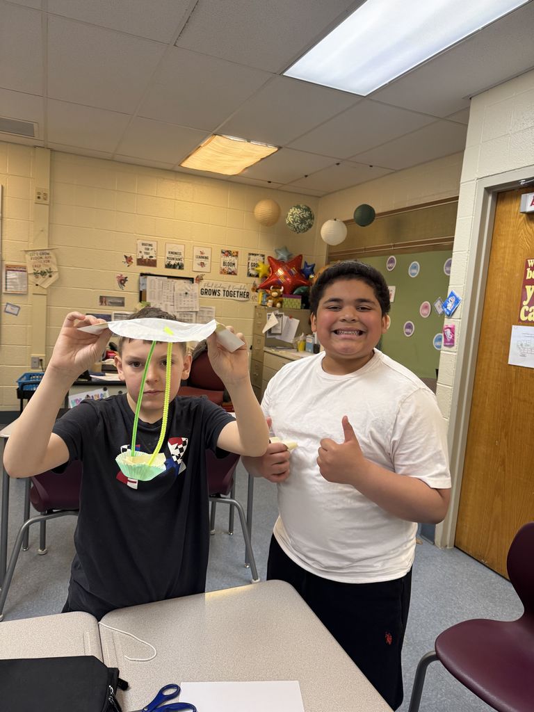 2 students posing with their peep