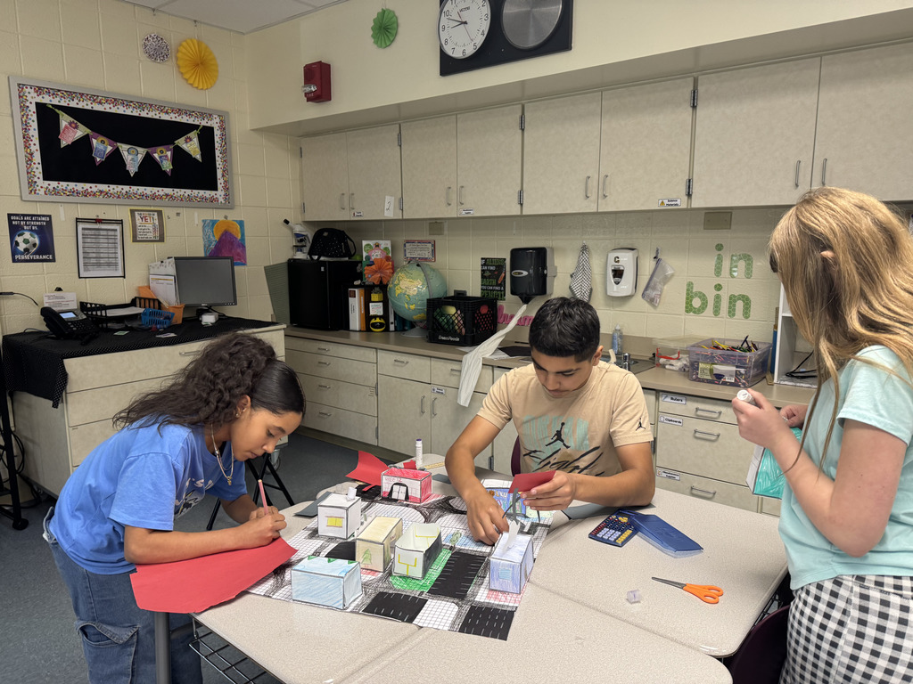 students working on geocity