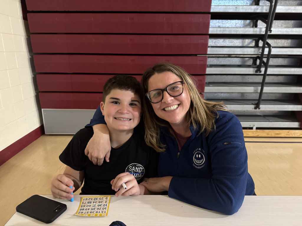 Student and parent sitting together smiling