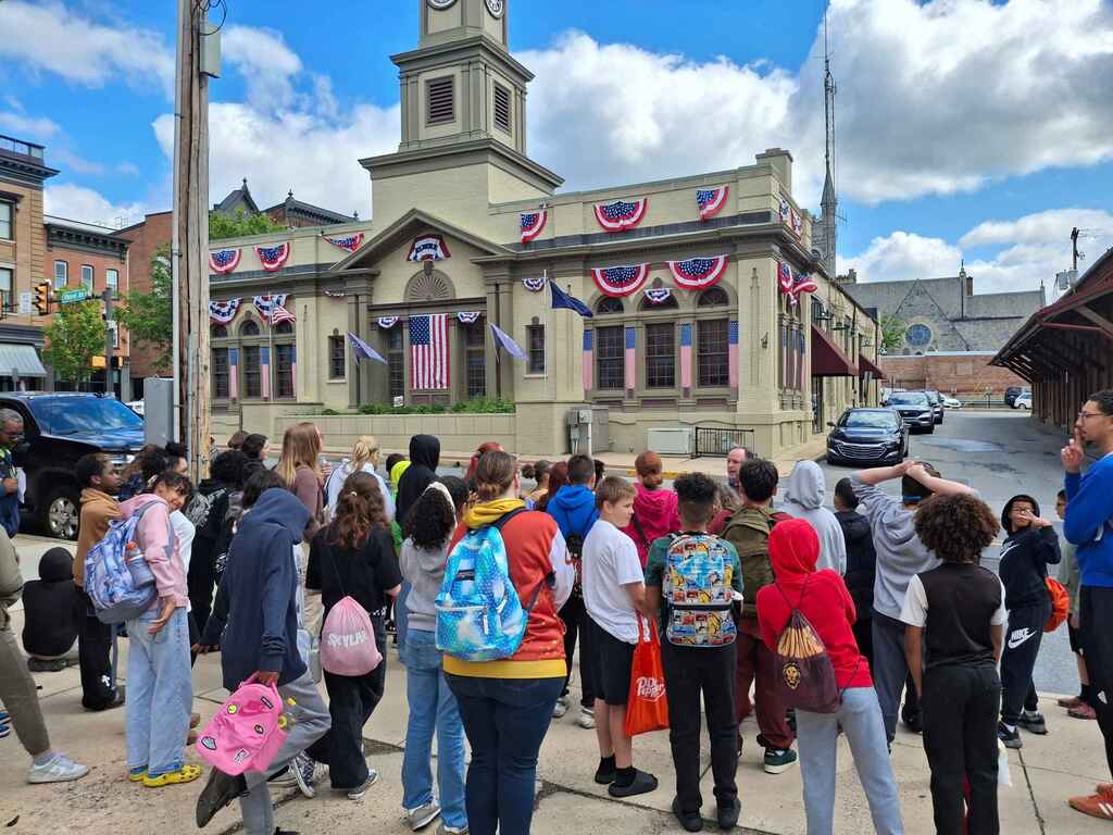 students standing outside the columbia police station