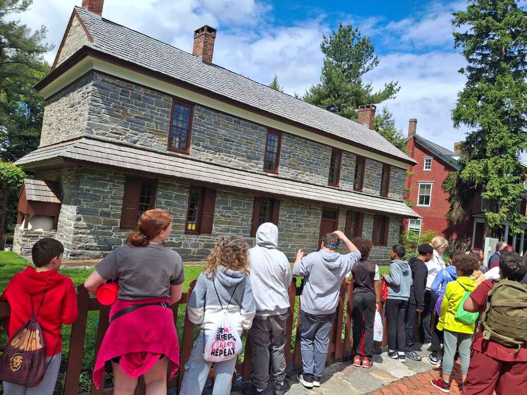students standing looking at a building