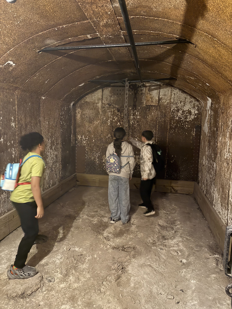 students walking and looking in the dungeon 